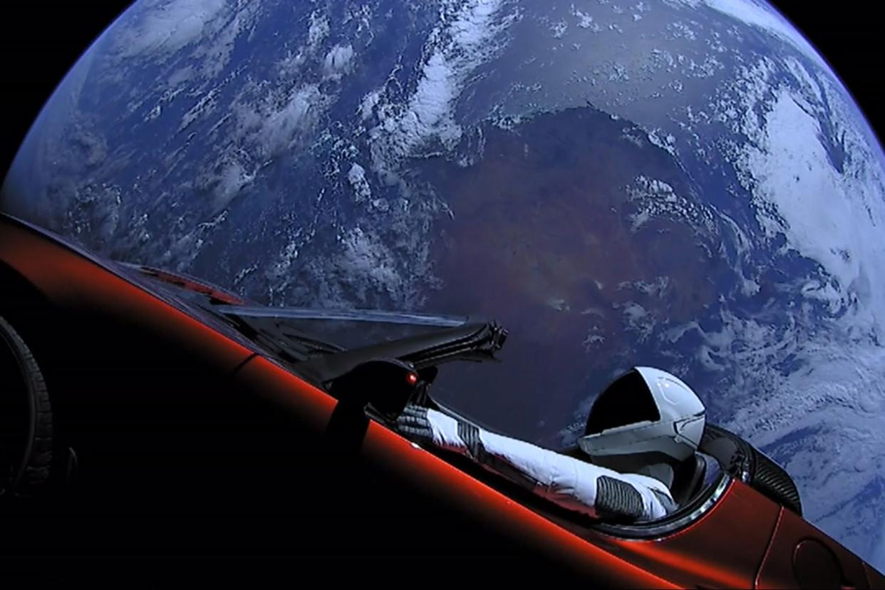 In this handout photo provided by SpaceX, a Tesla roadster launched from the Falcon Heavy rocket with a dummy driver named "Starman" heads towards Mars.