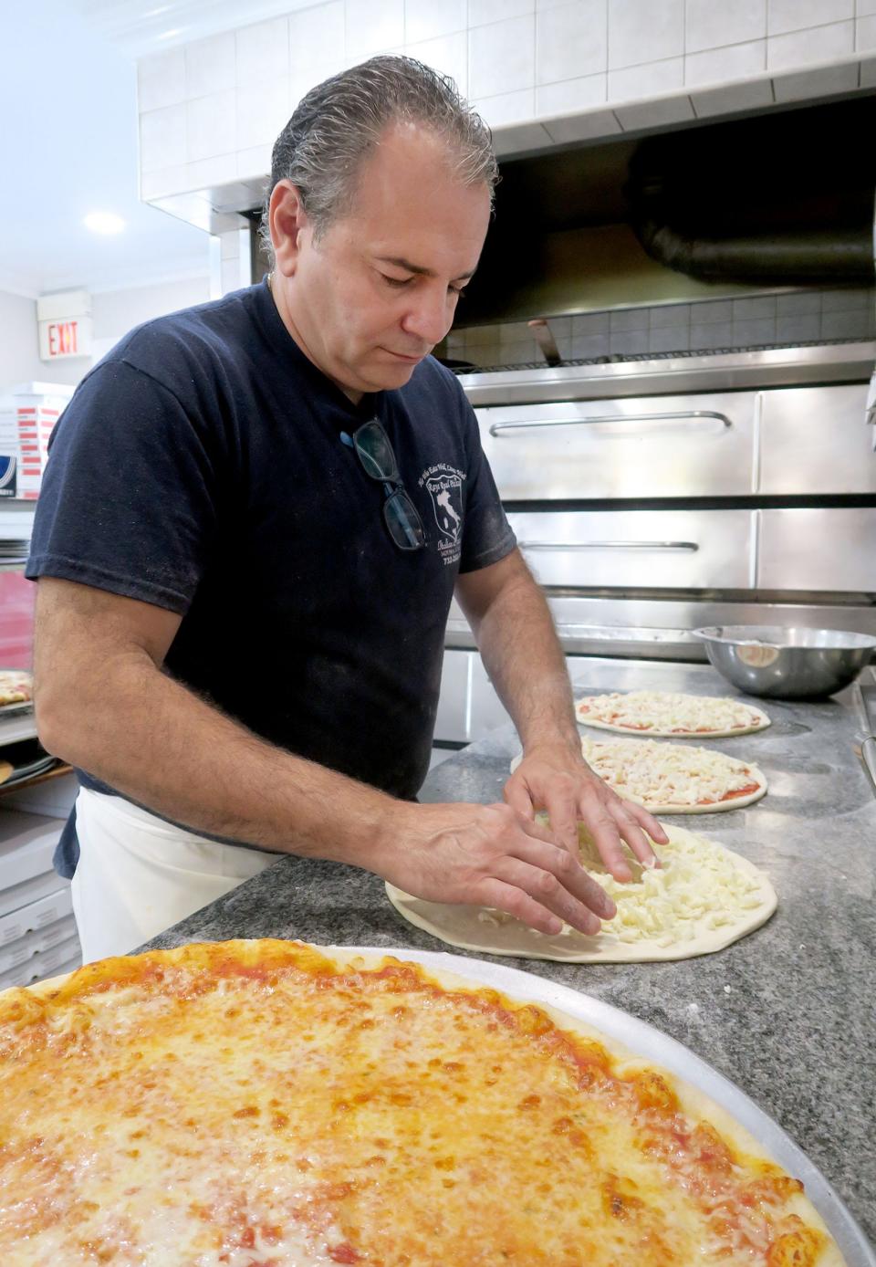 Ray's Real Pizza owner Marco Russo prepares a pizza Wednesday, August 10, 2022, at the Hazlet-based restaurant. 