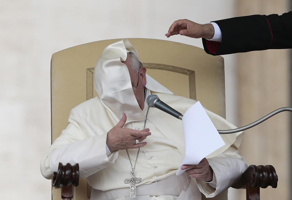 A gust of wind blows Pope Francis' mantle as he leads his Wednesday general audience in Saint Peter's square at the Vatican September 11, 2013. REUTERS/Tony Gentile (VATICAN CITY - Tags: RELIGION TPX IMAGES OF THE DAY)