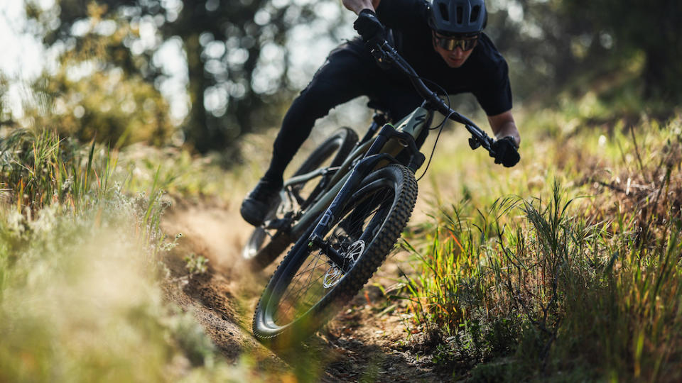 A man riding a mountain bike with a new DVO fork