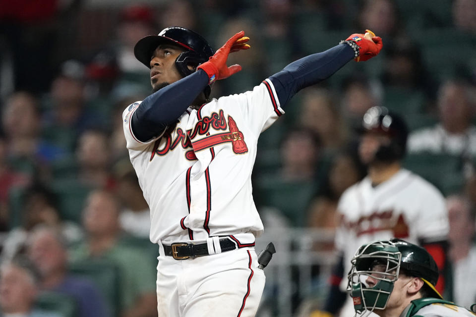 Atlanta Braves' Ozzie Albies watches his three-run home run during the seventh inning of the team's baseball game against the Oakland Athletics on Wednesday, June 8, 2022, in Atlanta. (AP Photo/John Bazemore)