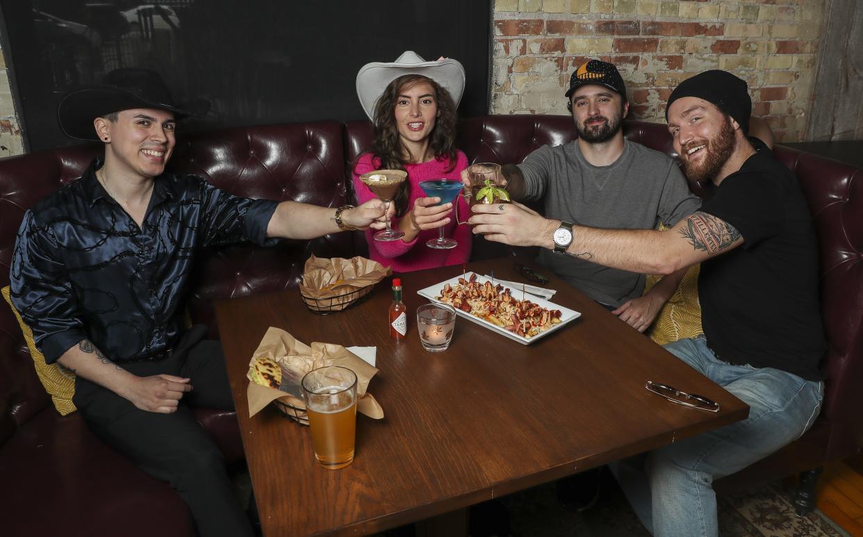 Rico Lugo, Kendyll Jayne, Alex Bougie and Jackson Mankowski pose for a portrait on Thursday, August 8, 2024, at The Porch in De Pere, Wis. Mankowski, is the owner of The Porch bar.