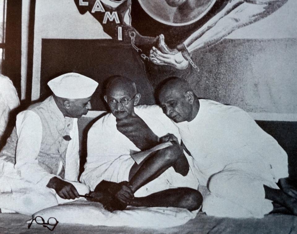 Mahatma Gandhi with Sardar Patel and Jawaharlal Nehru. 1947. Gandhi was the preeminent leader of the Indian independence movement in British-ruled India. Sardar Vallabhbhai Patel was an Indian statesman, a leader of the Indian National Congress and a founding father of the Republic of India. Universal History Archive—UIG/Getty Images. | Universal History Archive—UIG/Getty Images.