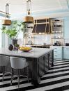 <p>Combined with the black and white diagonal-striped marble floors, the gold details in fixtures, and the icy blue cabinets, the white tiled backsplash is merely a simple backdrop in this <a href="https://www.elledecor.com/design-decorate/house-interiors/a26133415/mary-mcdonald-two-faced-founders-house-tour-california/" rel="nofollow noopener" target="_blank" data-ylk="slk:maximalist California dream home;elm:context_link;itc:0;sec:content-canvas" class="link ">maximalist California dream home</a>.</p>