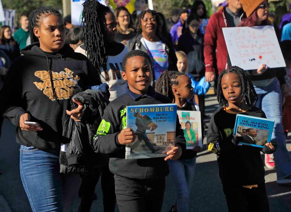 Marchers move along the route at the Martin Luther King Jr. parade in Daytona Beach on Monday, Jan.16th,2023.