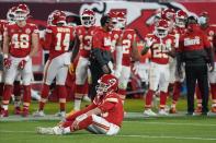 Kansas City Chiefs quarterback Patrick Mahomes (15) sits on the turf during the second half of the NFL Super Bowl 55 football game against the Tampa Bay Buccaneers, Sunday, Feb. 7, 2021, in Tampa, Fla. (AP Photo/David J. Phillip)