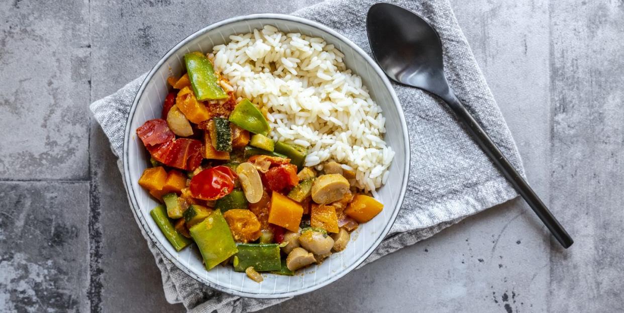 bowl of vegan sweet potatoe curry with rice, best types of carbs