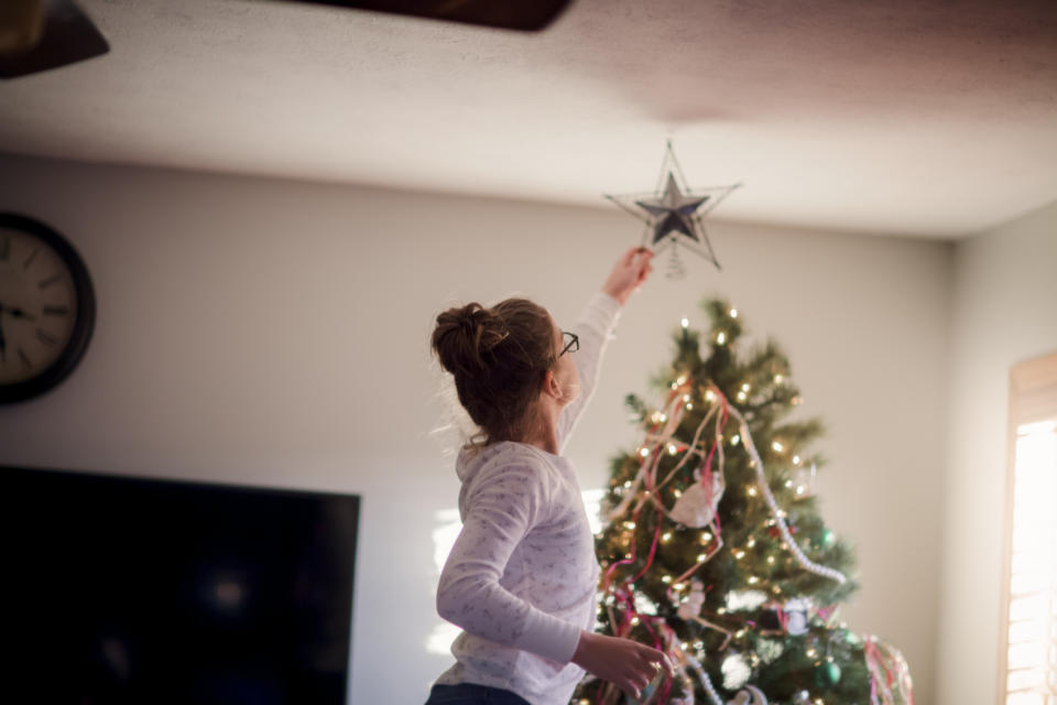 People are already putting up their Christmas trees this year. (posed by model, Getty Images)