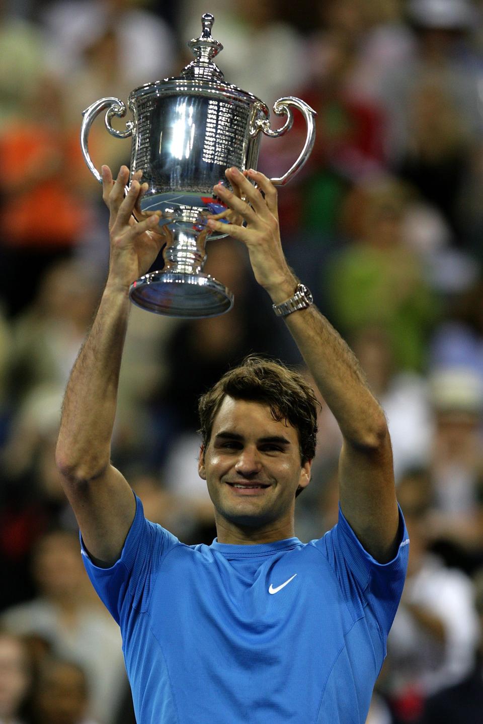 <p>Federer lifts the championship trophy after defeating Andy Roddick in the men’s final of the U.S. Open on September 10, 2006. </p>