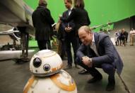 Britain's Prince William, smiles at BB-8 droid during a tour of the Star Wars sets at Pinewood studios in Iver Heath, west of London, Britain on April 19, 2016. REUTERS/Adrian Dennis/Pool