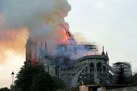 As onlookers watched the cathedral burn, they mourned the historic building. “It hurts to watch this. The cathedral is the symbol, the heart of Paris,” Pierre-Eric Trimovillas told the <em><a rel="nofollow noopener" href="https://www.nytimes.com/2019/04/15/world/europe/notre-dame-fire.html?smid=tw-nytimesworld&smtyp=cur" target="_blank" data-ylk="slk:Times;elm:context_link;itc:0;sec:content-canvas" class="link ">Times</a> </em>before saying that the crowd gasped and cried while watching the spire fall. He added: “Paris is beheaded.”