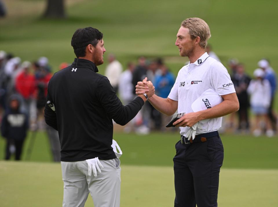 Mito Pereira, left, shakes hands with Will Zalatoris after putting on the 18th green during the third round. Zalatoris will start in the second-to-last group and Pereira the final group on Sunday.