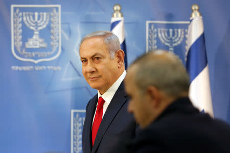 Israel's Prime Minister Benjamin Netanyahu arrives to deliver a statement to the members of the media in Tel Aviv, Israel November 18, 2018. REUTERS/Corinna Kern