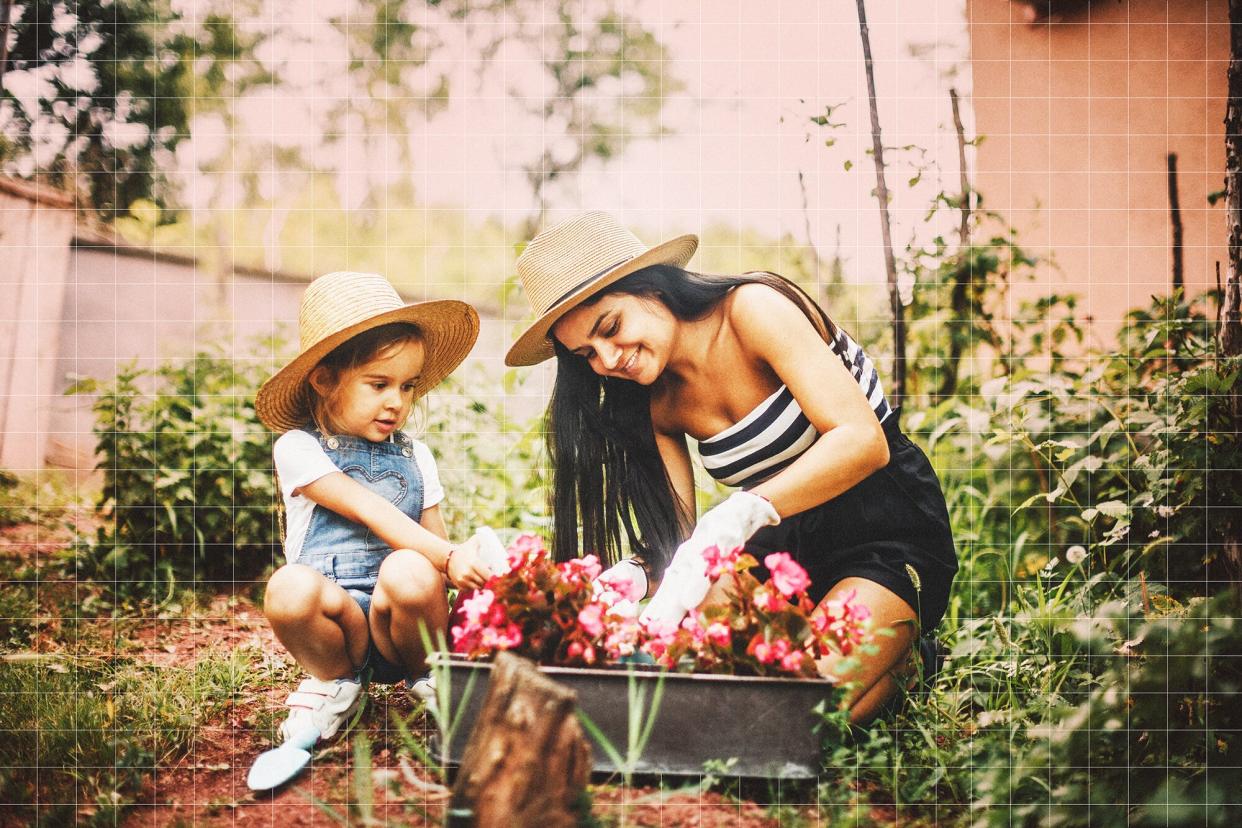 Mother And Daughter Working In The Garden