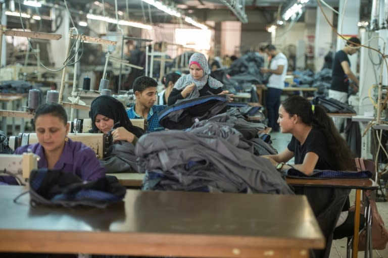 Tailors work at the Marie Louis factory, where long-fibre Egyptian cotton is used to produce high quality clothing for sale in France, Italy and Egypt