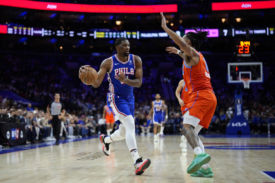 Philadelphia 76ers' Joel Embiid, left, tries to get past Oklahoma City Thunder's Jaylin Williams during the first half of an NBA basketball game, Tuesday, April 2, 2024, in Philadelphia. (AP Photo/Matt Slocum)