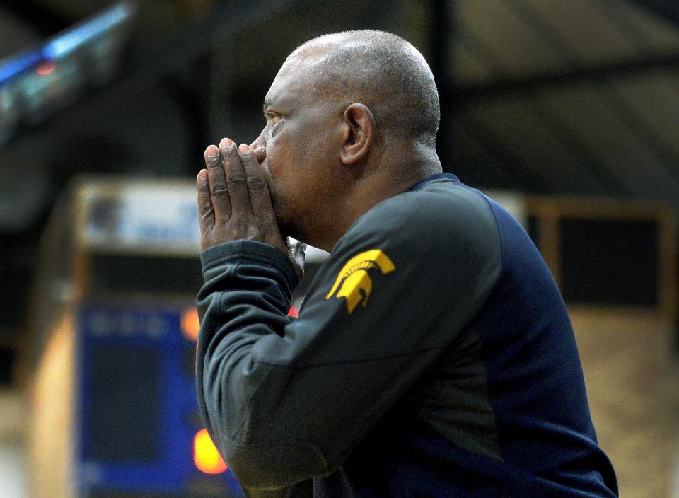 Southeast Basketball Coach Lawrence Thomas yells to his players during a game against Lincoln last December.