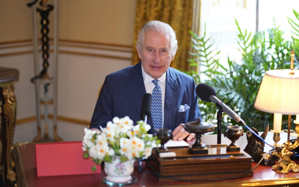 The King at Buckingham Palace recording an audio message played at the Royal Maundy service