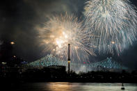 <p>Fireworks explode over an illuminated Jacques Cartier Bridge to celebrate the city’s 375th birthday Wednesday, May 17, 2017, in Montreal. (Photo: Graham Hughes/The Canadian Press via AP) </p>