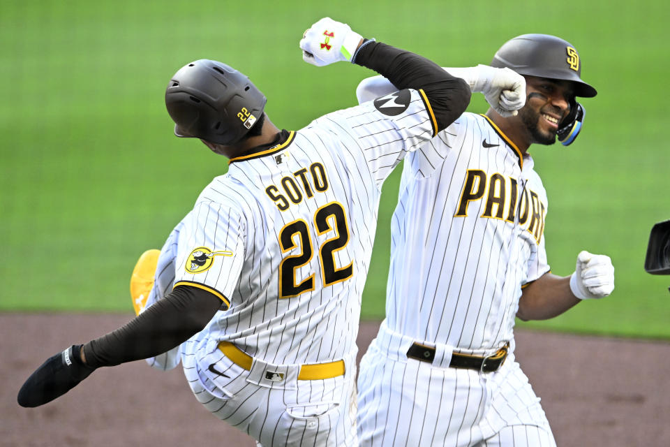 San Diego Padres' Xander Bogaerts, right, gets congratulations from Juan Soto after hitting a two-run home run against the Colorado Rockies during the first inning of a baseball game in San Diego, Saturday, April 1, 2023. (AP Photo/Alex Gallardo)