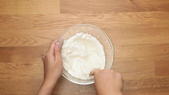 Mixing flour in a bowl