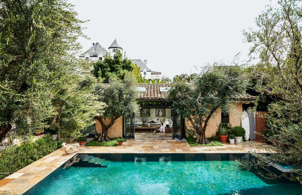 To preserve their views of Chateau Marmont and downtown L.A., the Misczynskis bought the lot adjacent to their home to build a pool, poolhouse, pergola, and garden.