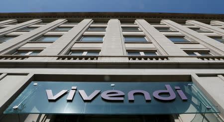 A logo is seen over the main entrance of the entertainment-to-telecoms conglomerate Vivendi's headquarters in Paris April 8, 2015. Picture taken April 8, 2015. REUTERS/Gonzalo Fuentes/File photo