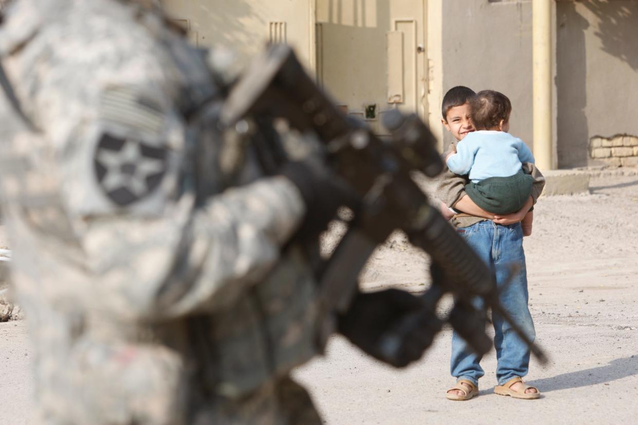 Army 2nd Battalion, 12th Infantry Regiment, Baker Company soldiers patrol in the mahallah (neighborhood) of Toma on the outskirts of Baghdad.