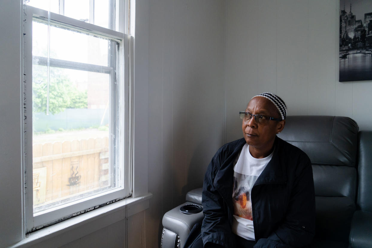 Barbara Mapps, sister of Katherine Massey, looks out the window of her sisters home.