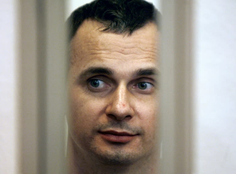 Ukrainian film director Oleg Sentsov looks out from the defendant's cage in a military courtroom during a hearing in Rostov-on-Don, Russia, July 27, 2015