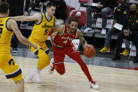 Ohio State's Duane Washington, right, drives the baseline against Iowa's C.J. Fredrick during the first half of an NCAA college basketball game Sunday, Feb. 28, 2021, in Columbus, Ohio. (AP Photo/Jay LaPrete)