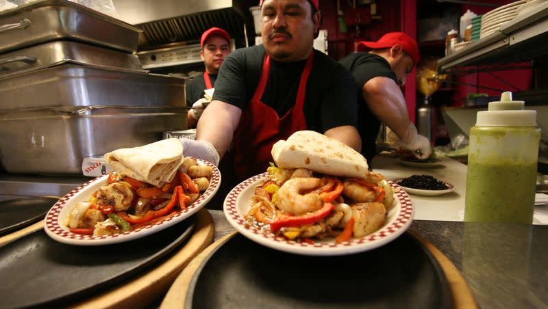 Carlos Velasquez prepares food at Red Iguana, near the new TRAX line on North Temple Street, in Salt Lake City on Friday, April 5, 2013.