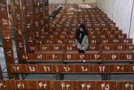 A 19-year-old Hazara Afghan sits and cries on the bench she was sitting on during Friday's suicide bombing at a Hazara education center, in Kabul, Afghanistan, Saturday, Oct. 1, 2022. Last week’s suicide bombing at the Kabul education center killed as many as 52 people, more than double the death toll acknowledged by Taliban officials, according to a tally compiled by The Associated Press on Monday. Dozens more were injured in Friday's blast, making it one of the bloodiest attacks since the Taliban seized control of Afghanistan more than a year ago. (AP Photo/Ebrahim Noroozi)