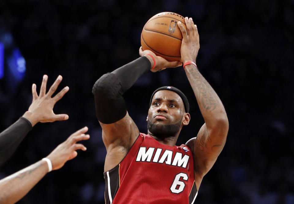 Miami Heat forward LeBron James (6) shoots a three-pointer in the second half of Game 4 of a second-round NBA playoff basketball game against the Brooklyn Nets at the Barclays Center, Monday, May 12, 2014, in New York. James tied his playoff career high with 49 points as the Heat defeated the Nets 102-96 to go ahead 3-1 in the best of seven series. (AP Photo)