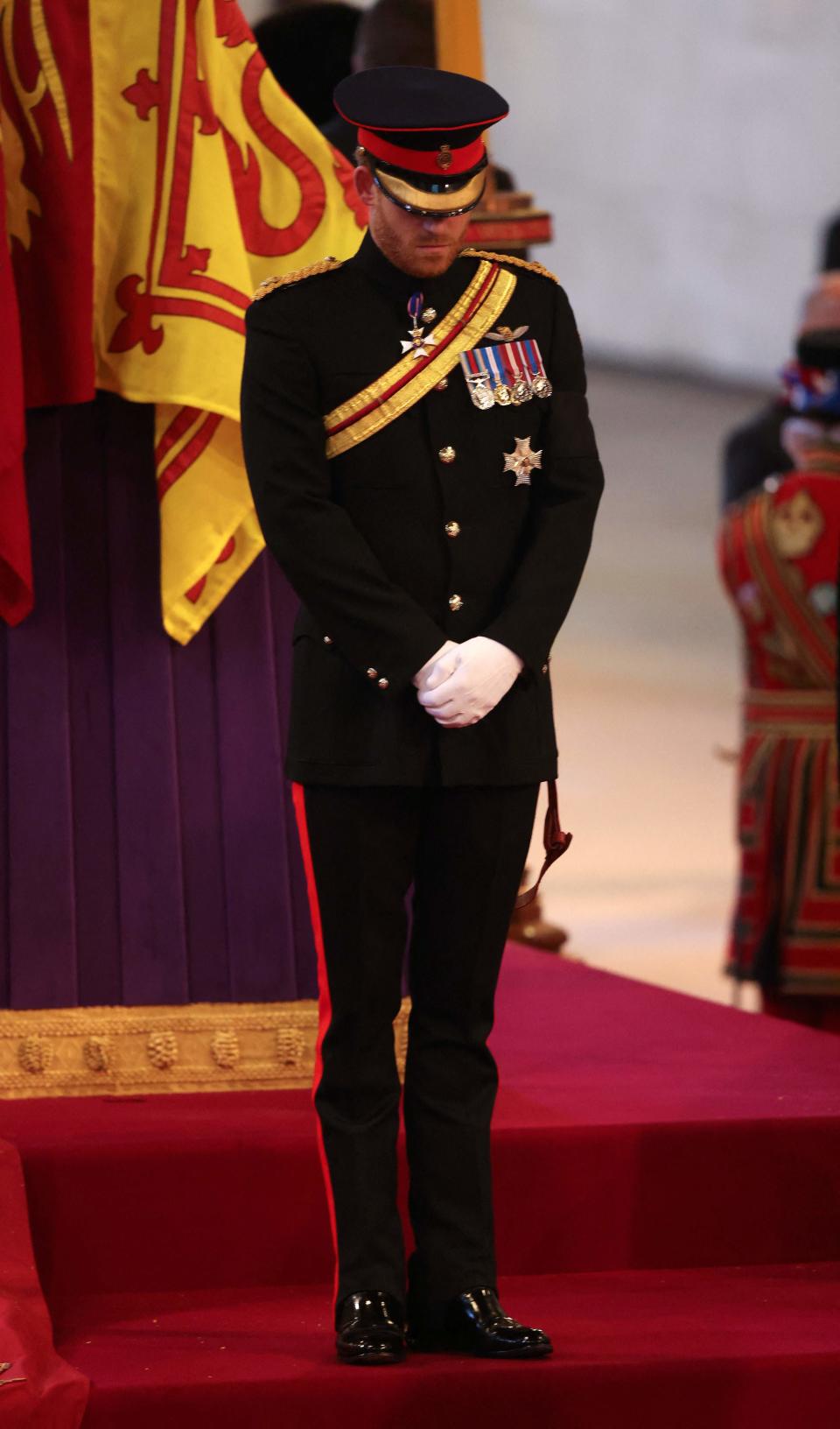 The Duke of Sussex stood beside his grandmother’s coffin as huge queues file past her coffin to pay their respects (POOL/AFP via Getty Images)