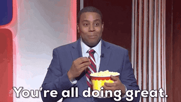 man eating popcorn saying, you're all doing great