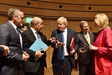 Danish Foreign Minister Anders Samuelsen and French Minister for Foreign Affairs Jean-Yves Le Drian talk with Britain's Foreign Secretary Boris Johnson, European commissioner Johannes Hahn and Austrian Foreign Minister Karin Kneissl during European Union foreign ministers meeting in Luxembourg, April 16, 2018. REUTERS/Eric Vidal