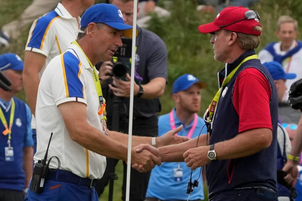 Steve Stricker shakes hands with Padraig Harrington after the Ryder Cup was won at Whistling Straits (Charlie Neibergall/AP) (AP)