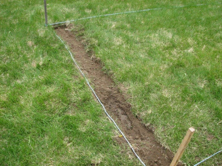 Lay out the borders of your garden with string and stakes, and then remove the grass.