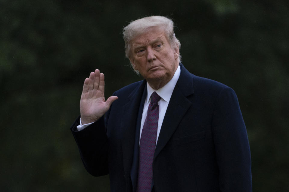 President Donald Trump waves as he walks from Marine One to the White House in Washington, Thursday, Oct. 1, 2020, as he returns from Bedminster, N.J. Trump and first lady Melania Trump have tested positive for the coronavirus, the president tweeted early Friday. (AP Photo/Carolyn Kaster)