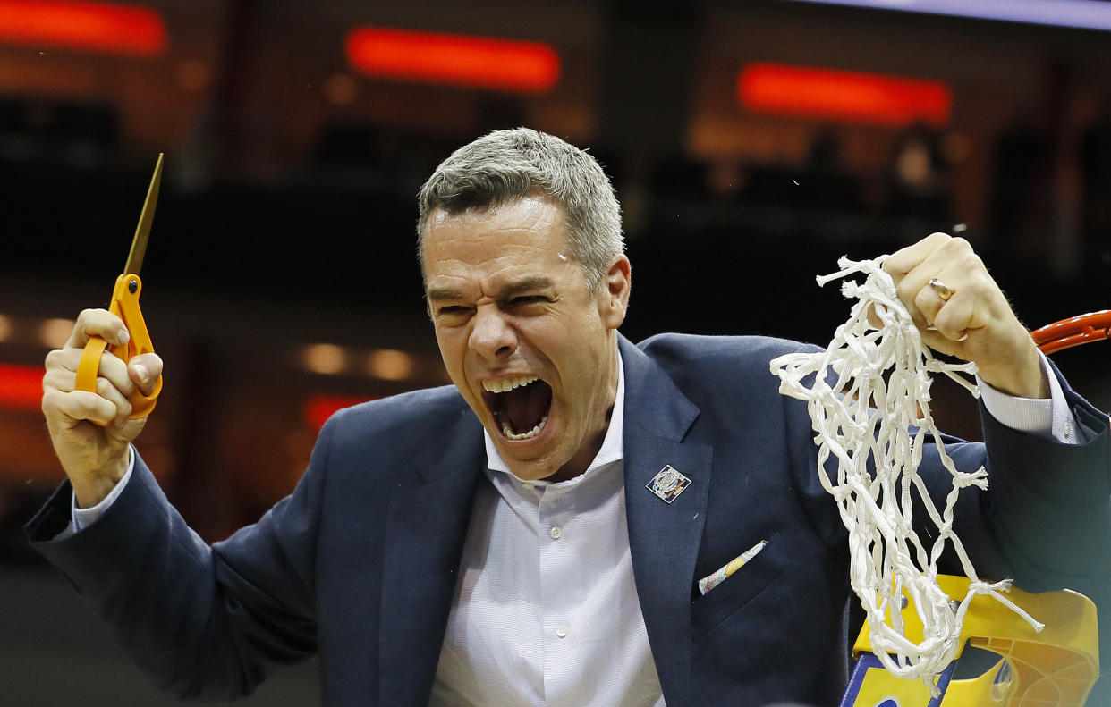 LOUISVILLE, KENTUCKY - MARCH 30:  Head coach Tony Bennett of the Virginia Cavaliers celebrates after defeating the Purdue Boilermakers 80-75 in overtime of the 2019 NCAA Men's Basketball Tournament South Regional to advance to the Final Four at KFC YUM! Center on March 30, 2019 in Louisville, Kentucky. (Photo by Kevin C.  Cox/Getty Images)