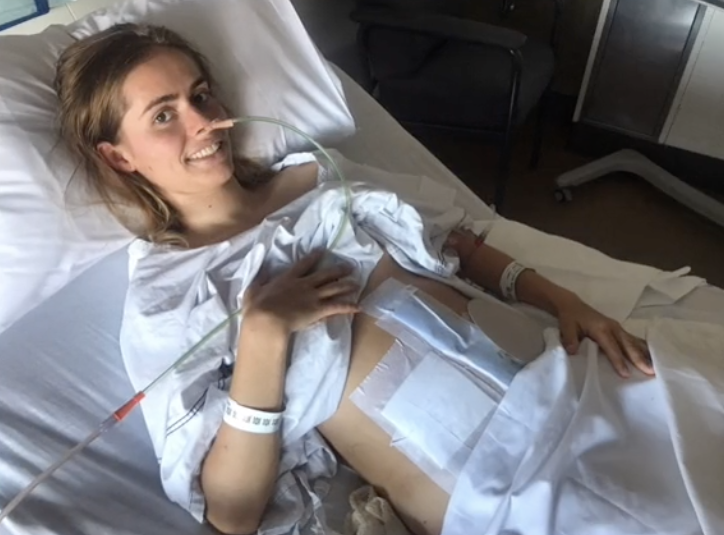 A photo of Matilda in hospital after her accident showing the scars on her stomach after surgery.