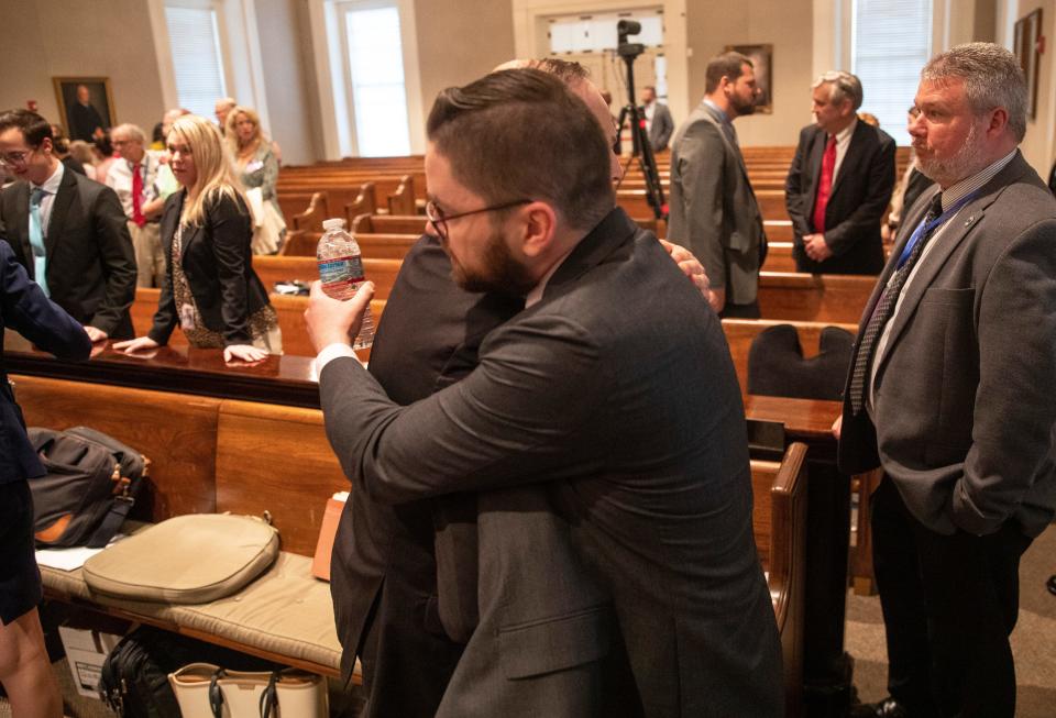 Attorney General Alan Wilson and Johnny Ellis James, Jr. hug during deliberation in the murder trial of Alex Murdaugh at the Colleton County Courthouse in Walterboro, SC on Thursday, March 2, 2023. 