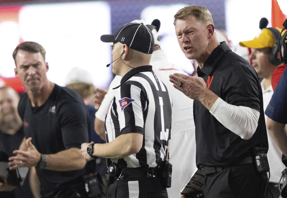 Nebraska coach Scott Frost protests a delay of game penalty for use of illegal signals, during the first half of the team's NCAA college football game against Michigan on Saturday, Oct. 9, 2021, in Lincoln, Neb. (AP Photo/Rebecca S. Gratz)