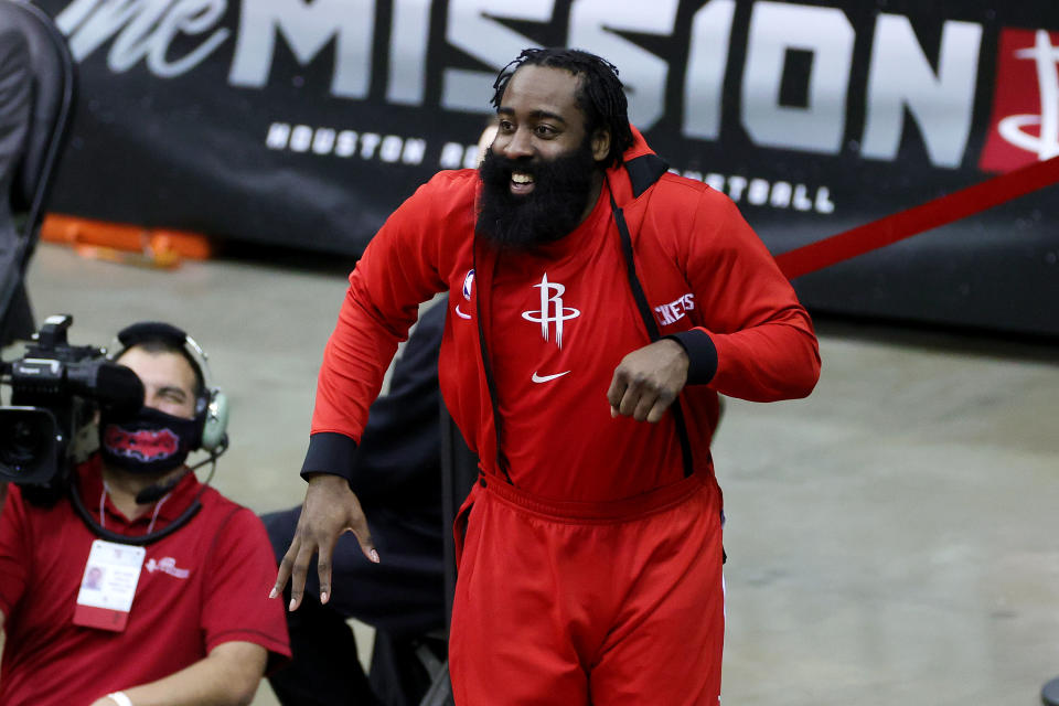 James Harden reacts on the bench during a game. 