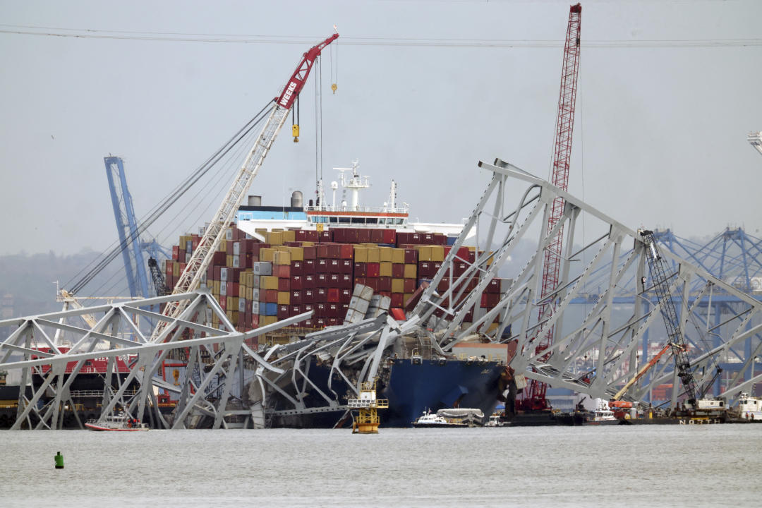 BALTIMORE, MD - APRIL 17: Workers remove shipment containers from the Dali cargo ship during the clean up at the Francis Scott Key Bridge in Baltimore, Maryland on April 17, 2024. Credit: mpi34/MediaPunch /IPX