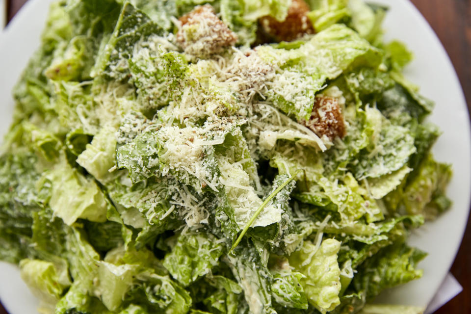 a plate of Caesar salad