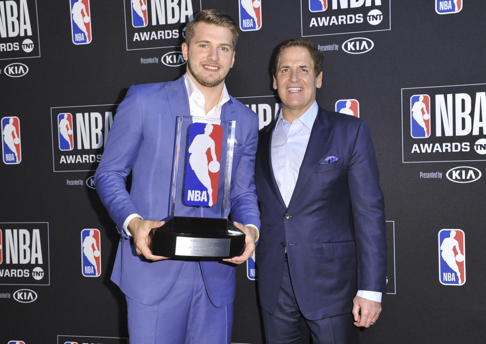 NBA player Luka Doncic, of the Dallas Mavericks, recipient of the NBA rookie of the year award, poses in the press room with Mark Cuban, governor of the Dallas Mavericks, at the NBA Awards on Monday, June 24, 2019, at the Barker Hangar in Santa Monica, Calif. (Photo by Richard Shotwell/Invision/AP)