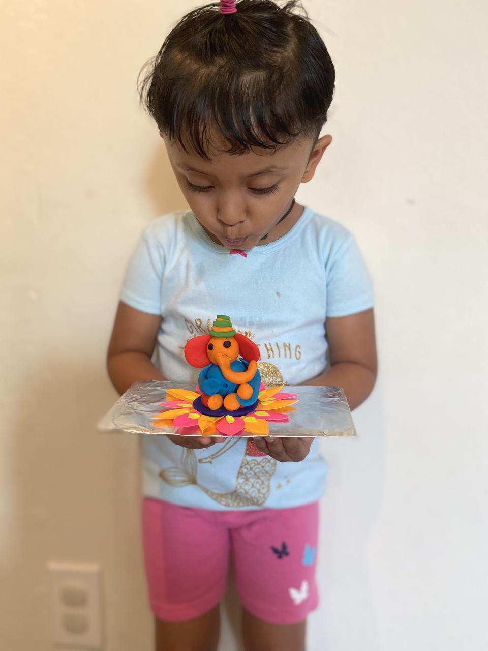 Bhagyashree Rath and Parthasarathi share pictures of this cutie with a wonderfully colourful Ganesha.