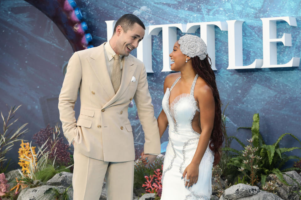 jonah hauer-king and halle bailey pose on a red carpet